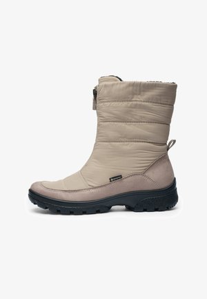 Beige waterproof boot with padded nylon upper, contrasting suede accents, rounded toe, and textured black rubber sole. Features zipper closure.