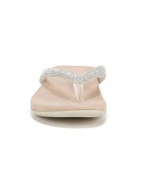 Infradito beige con una cinghia metallica e scintillante. Soletta morbida simile a suede con una forma sagomata e un design minimalista. Suola flessibile.