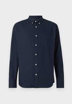 Camisa de botones azul marino de manga larga, con cuello, placket frontal con botones y un bolsillo en el pecho. Fabricada con una tela suave.