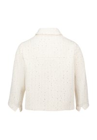 Witte textuurerende jas met een kraag, driekwartmouwen en versierd met kleine gouden spikkels. Heeft een schouderpas aan de achterkant.