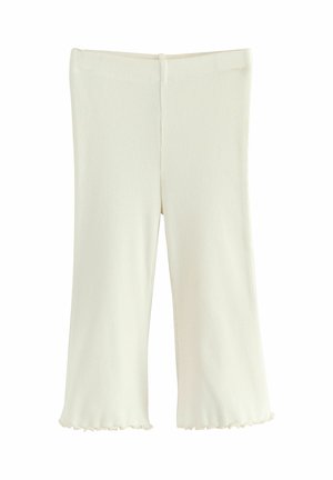 Ribbed kremowe legginsy o luźnym kroju, z rozszerzanym dołem, elastycznym paskiem w talii oraz miękkim, teksturowanym materiałem.