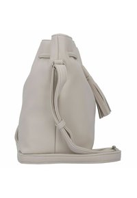 Beige-farbene Ledertasche in Beutelform mit strukturierter Oberfläche, Kordelzugverschluss und seitlichem Quastenanhänger. Verstellbarer Riemen für vielseitige Tragemöglichkeiten.