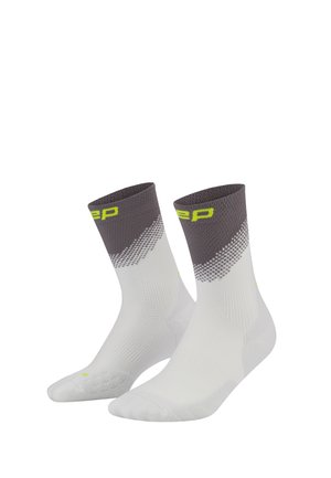 Pair of white and gray crew socks with yellow text detail on the gray cuff and a subtle checkered pattern below the cuff.