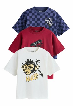 Three folded kids’ t-shirts: white with monkey and "WILD" print, red with skateboard and "NYC," blue checkered with "LA" text.