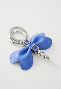 Blue leather keychain with a bow design, silver hardware, and a decorative bead accent. Features square purple detail near the center.