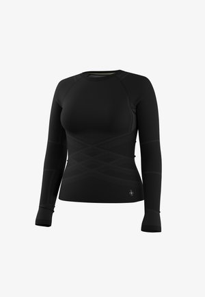 T-shirt de sport noir à manches longues, ajusté, avec des motifs géométriques subtils et un petit logo réfléchissant près de la taille.