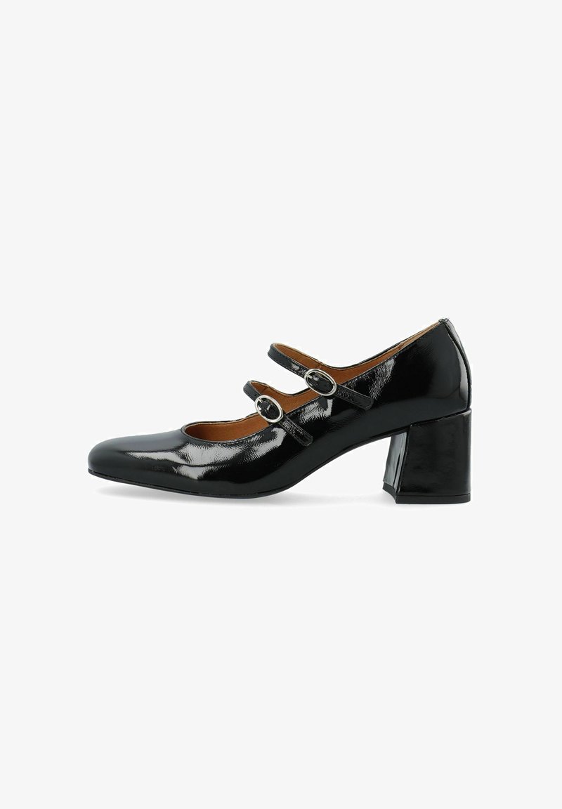 Décolleté in pelle verniciata nera con punta quadrata, due cinturini regolabili, fibbie in metallo e tacco a blocco di 4 cm. Texture liscia e finitura brillante.