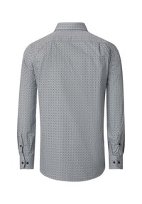 Lange mouwen shirt in wit en marineblauw met een geometrisch patroon. Voorzien van een puntkraag en knoopmanchetten. Gelaagde stof.