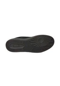 Sole di sneaker nera in gomma testurizzata, con un motivo a spina di pesce, dettaglio di presa circolare e leggero rialzo nella zona del tallone.