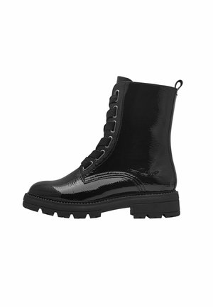 Black patent leather ankle boot with textured surface, round toe, lace-up front, and chunky sole featuring deep treads.