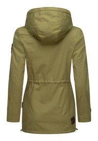 Green, polka-dotted rain jacket with a hood, drawstring waist, and side zippers. Features tan accents near the hem and sleeves.