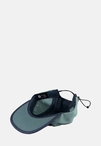 Wide-brimmed cap featuring a soft green fleece body, navy accents, and adjustable strap. Inside includes ventilation holes and brand label.