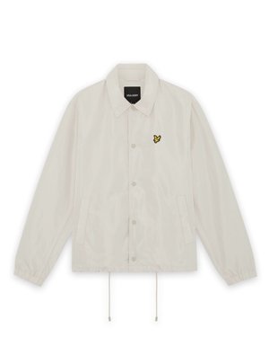 Lysebeige skjortejakke med krave, elastiske manchetter, forlommer, snoretræk i kanten og lille gul fuglelogo på venstre bryst.