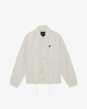 Svetlobéžová zapínacia bunda s golierom, elastickými manžetami, prednými vreckami, sťahovaním na spodnom okraji a malým žltým logom vtáčika na ľavej hrudi.