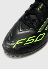 adidas Performance F50 CLUB UNISEX - Kopačky na umelý trávnik - core black/iron-coloured/lucid lemon