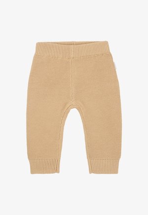 Pantalons en tricot crème pour tout-petit avec une taille et des poignets côtelés. Texture douce, design sans coutures et petite étiquette sur le côté.