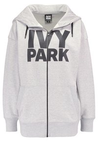 Szara bluza z kapturem wykonana z materiału polarowego, z zamkiem błyskawicznym z przodu, dużym logo „IVY PARK”, dwoma przednimi kieszeniami i kapturem ze sznurkiem do regulacji.