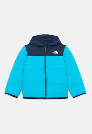 Light blue puffer jacket with a navy hood and upper panel. Features a front zipper and quilted texture. Logo displayed on the chest.