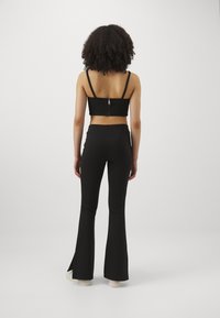 Calvin Klein Jeans SCULPTED MILANO - Kelnės - black