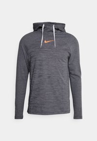 Grau Hoodie mit langen Ärmeln und strukturiertem Muster, ausgestattet mit einer weißen Kordel, einem orangefarbenen Nike-Logo auf der Brust und einer lässigen Passform.