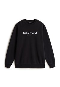 Sorte sweatshirt lavet af bomuld med rund halsudskæring. Har hvid tekst "fortæl en ven" over brystet. Lange ærmer og ribbede manchetter.