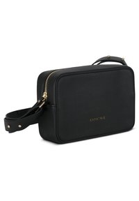 Schwarze Leder-Crossbody-Tasche mit rechteckiger Form, goldenen Reißverschlussdetails, abnehmbarem Schulterriemen und geprägt gedrücktem Markennamen auf der Vorderseite.