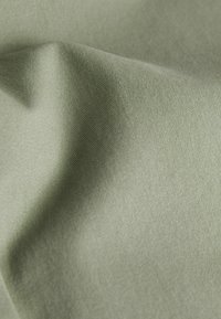 Next SLIM FIT STRETCH - Pantaloni chino - sage green