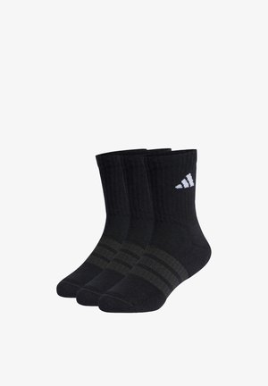 Drie paar zwarte enkelsokken met donkergrijze strepen en een wit merkteken op de boord, naast elkaar weergegeven op een witte achtergrond.