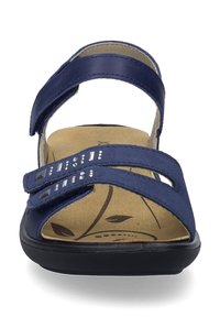 Tummansinisiä sandaaleja, joissa on kaksi säädettävää remmiä, pehmustettu pohja, jossa on lehden kuvio, sekä hienovaraiset kimallekoristeet remmeissä.