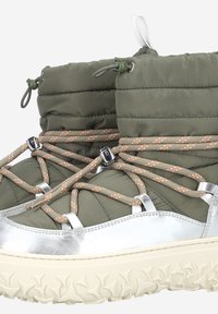 Green, padded winter boots with silver accents, textured sole, and orange-braided laces. Features toggle pulls for adjustable fit.