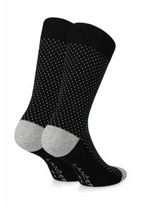 Czarne skarpetki z małym białym wzorem w kropki, z szarym akcentem na palcach i pięcie. Wykonane z miękkiego, dzianinowego materiału.