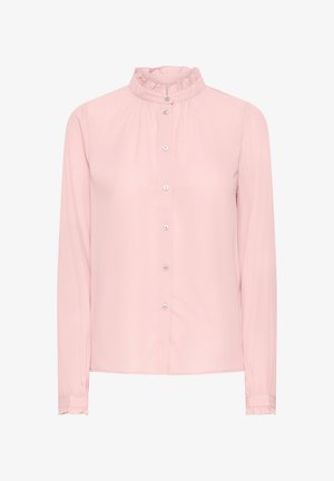 Kerge roosa pika varrukaga pluus, millel on volangiga kõrge kaelus, esine nupuvajutus ja kogutud varrukad. Valmistatud siledast kangast.