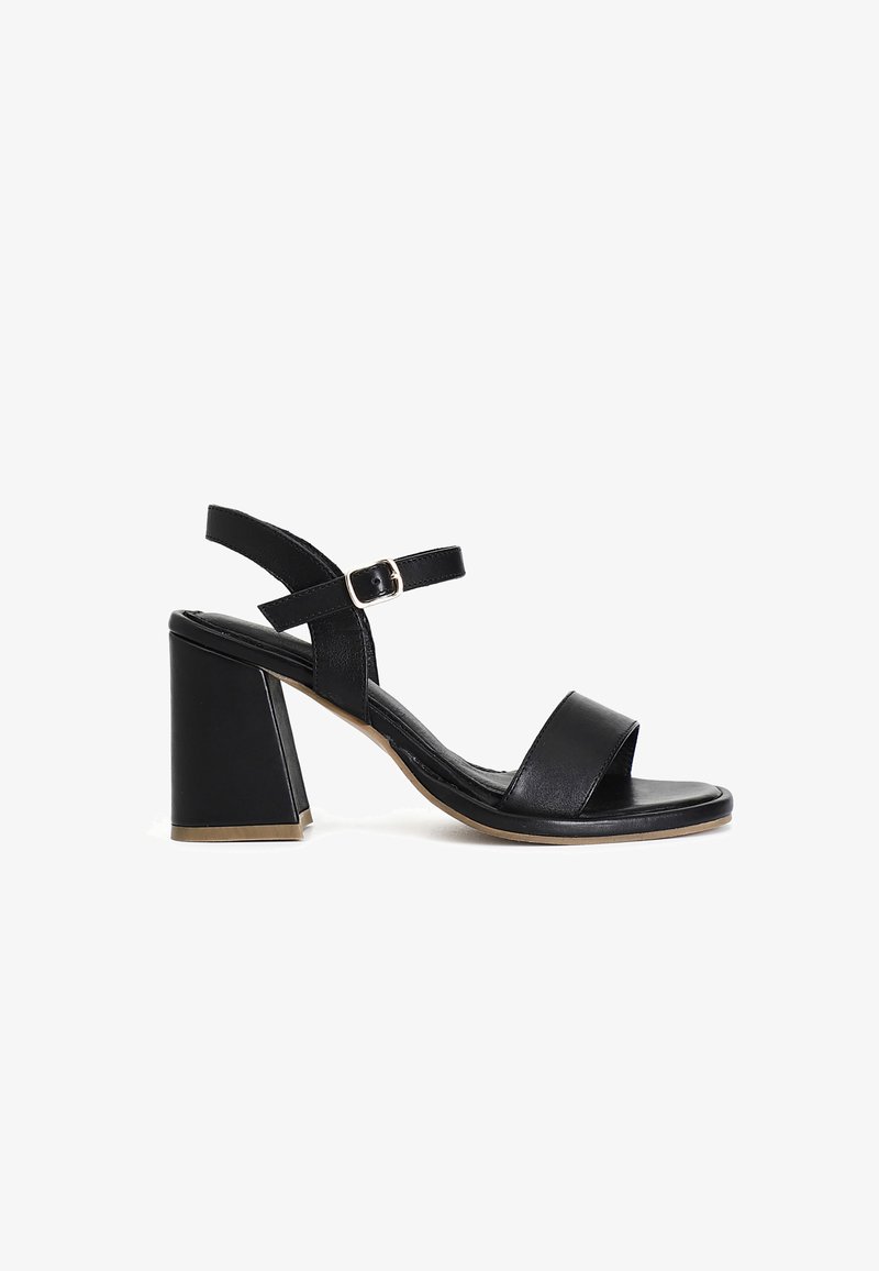 Black heeled sandal with a open-toe design, wide front strap, adjustable ankle strap, and a chunky block heel. Smooth leather texture.