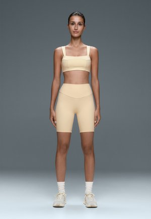 OYSHO, MEDIUM-SUPPORT COMFORTLUX SPORTS BRA WITH SEAMS - Brassière - butter yellow