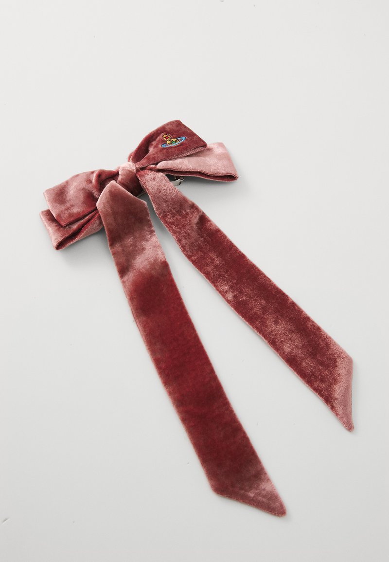 Velvet hair bow in muted rose color, featuring a central knot and long, tapered ties. Embroidered accent detail on one side.