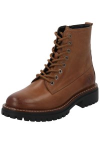 Stivale in pelle marrone con lacci, punta arrotondata, occhielli metallici, suola in gomma e dettagli di cucitura a contrasto. Logo impresso sul lato.