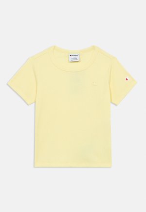 Lichtgele, korte mouw, geribd T-shirt met ronde hals en klein Champion-logo op borst en mouw, maat small, gemaakt in Vietnam.