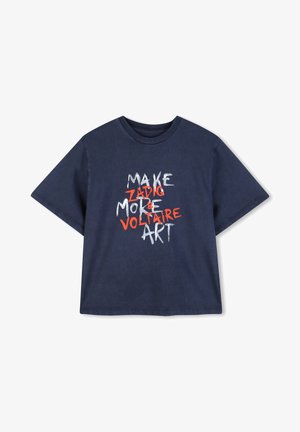 Navy blue cotton t-shirt featuring a graphic print in white and orange text that reads "MAKE ZADIG MORE VOLTAIRE ART." Short sleeves, relaxed fit.