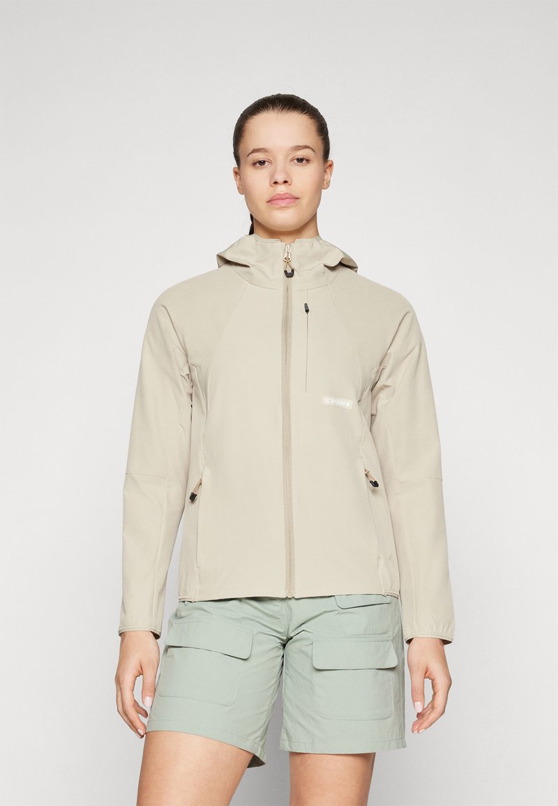 Veste zippée beige clair avec capuche, dotée de poches avant, d'une finition texturée et de cordons ajustables aux poignets et à l'ourlet.