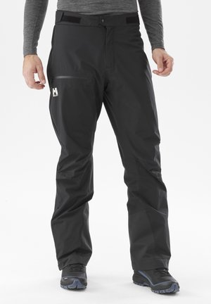 - Długie spodnie trekkingowe