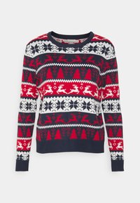 Röd, vit och marinblå stickad tröja med ett geometriskt och festligt mönster med renar, träd och snöflingor. Rundhalsad och långa ärmar.