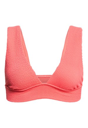 Bralette testurizzato color corallo con spalline larghe, design a V e una fascia sotto il busto. Il materiale sembra elastico con una superficie a costine.