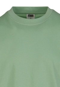 Mėtų žalios spalvos medvilninis marškinėliai su apvalia iškirpte, su subtilia tekstūra ir etikete „URBAN CLASSICS“, dydis M.