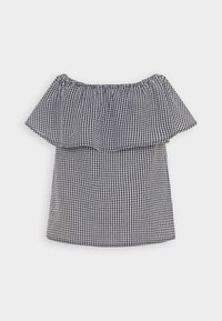 Haut off-the-shoulder en motif vichy noir et blanc, avec un col à volants et une coupe droite, fabriqué en tissu léger.