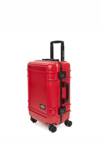 Hard-shell red luggage with a textured finish, black accents, a retractable handle, and four wheels for easy mobility. Includes a combination lock.