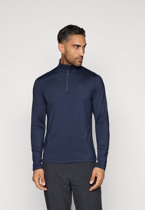 Navyblaues Langarm-Zip-Up-Oberteil mit Stehkragen, aus einem glatten, dehnbaren Stoff gefertigt. Dezentes Logo auf der Brust, minimalistisches Design.