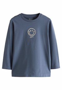 T-shirt en coton bleu à manches longues avec un col rond. L'avant présente un logo de smiley doré avec le texte "NY" et "24/7".