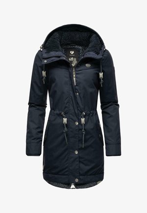 Marineblå parka med en struktureret, fleeceforet hætte, snoretræk i taljen og frontlynlås. Har to sidelommer og mønstret foer.