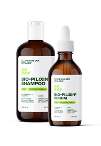 Brune glasflasker med hvide kapsler. Shampoen (250 ml) har en grøn etiket, mens serumet (100 ml) har en pipette og lignende branding.