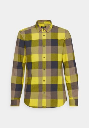 Langarmshirt met een groot ruitpatroon in geel, olijfgroen en donkerbruin. Met knoopsluiting en knoopschaft. Zachte textuur.